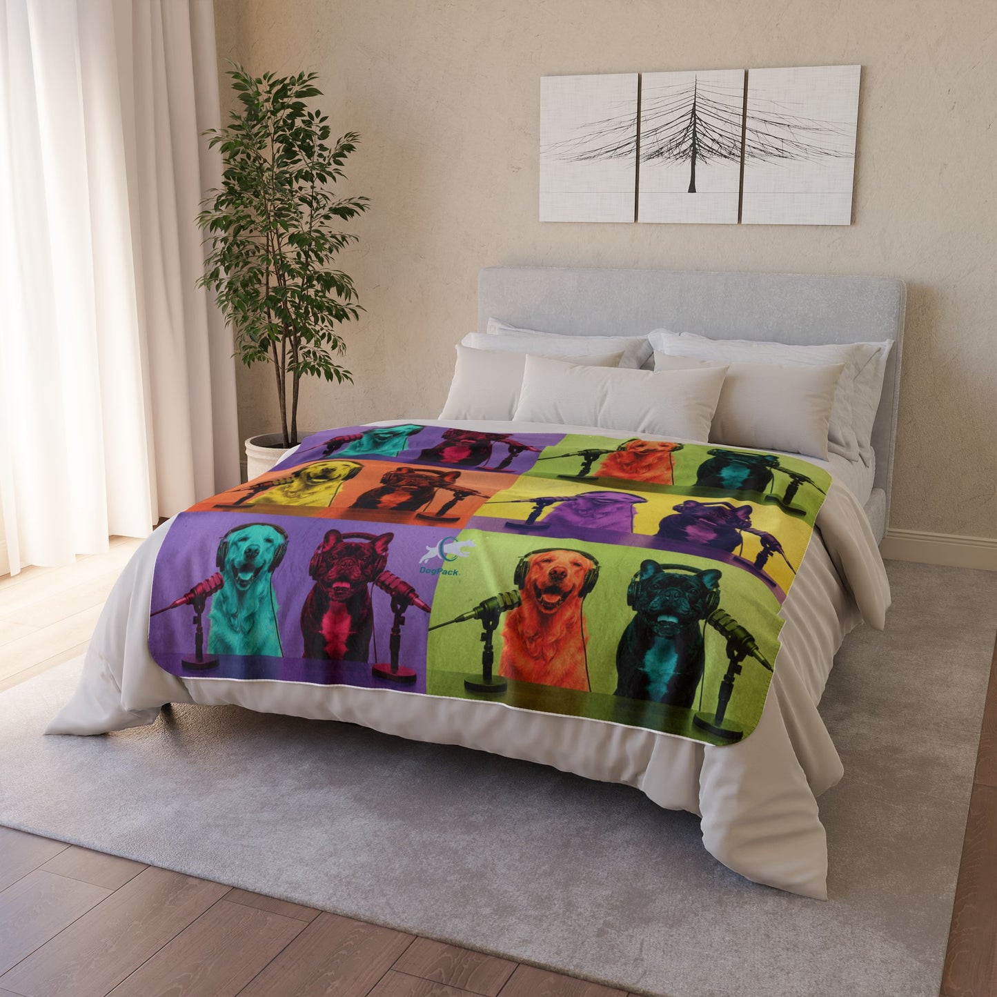 Bed with a colorful blanket featuring dog illustrations in a bedroom setting.
