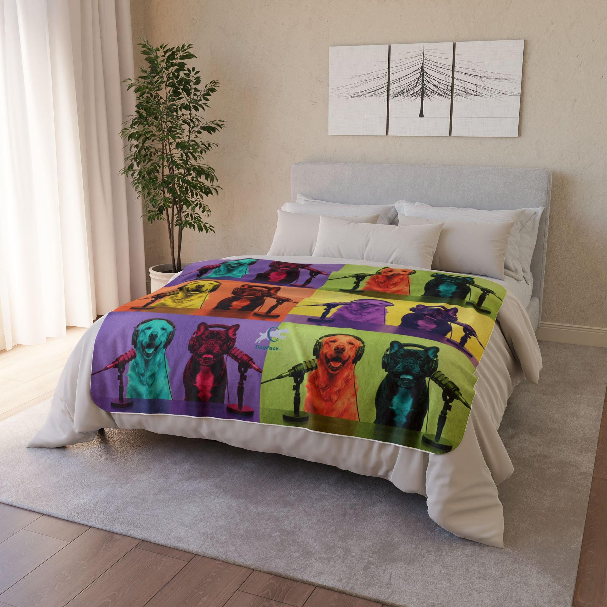 Bed with a colorful blanket featuring dog illustrations in a bedroom setting.